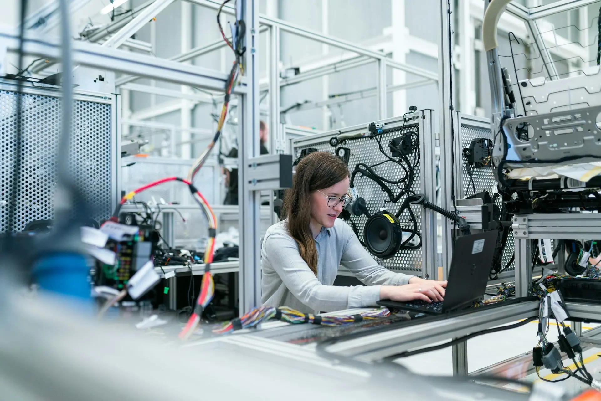 Technicians in semiconductor cleanroom working on wafer fabrication